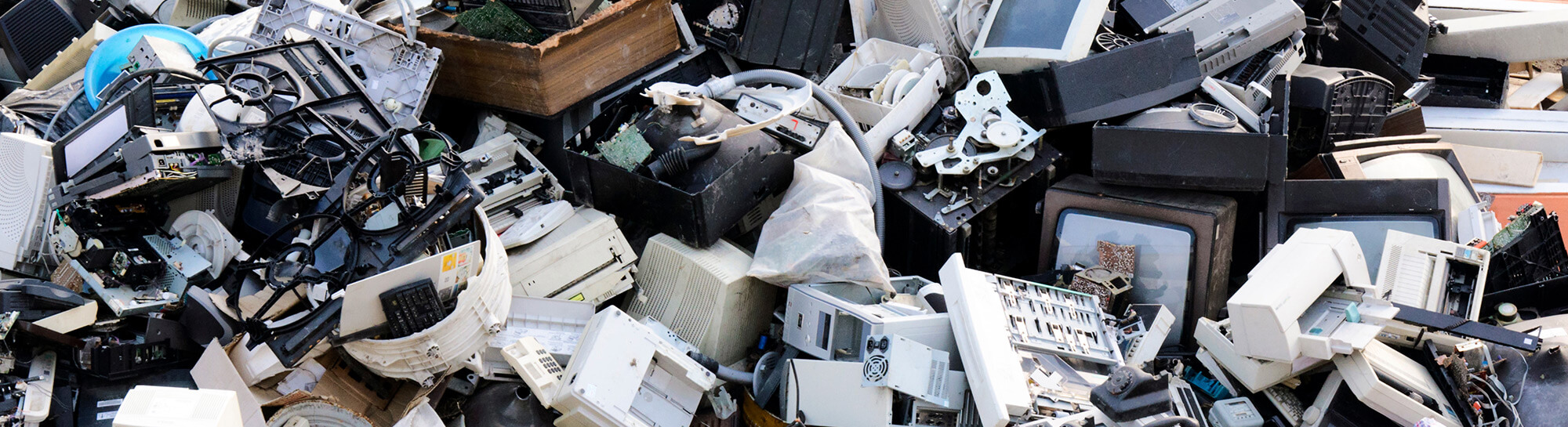 Pile of obsolete computers, scanners, and electronic devices